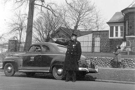 Officer Albert Demchak at Lefferts Boulevard and Kew Gardens Road in Kew Gardens, NY - 1948.