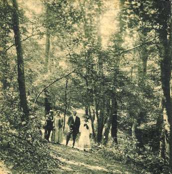 A family walking somewhere in Forest Park around the turn of the 19th Century.